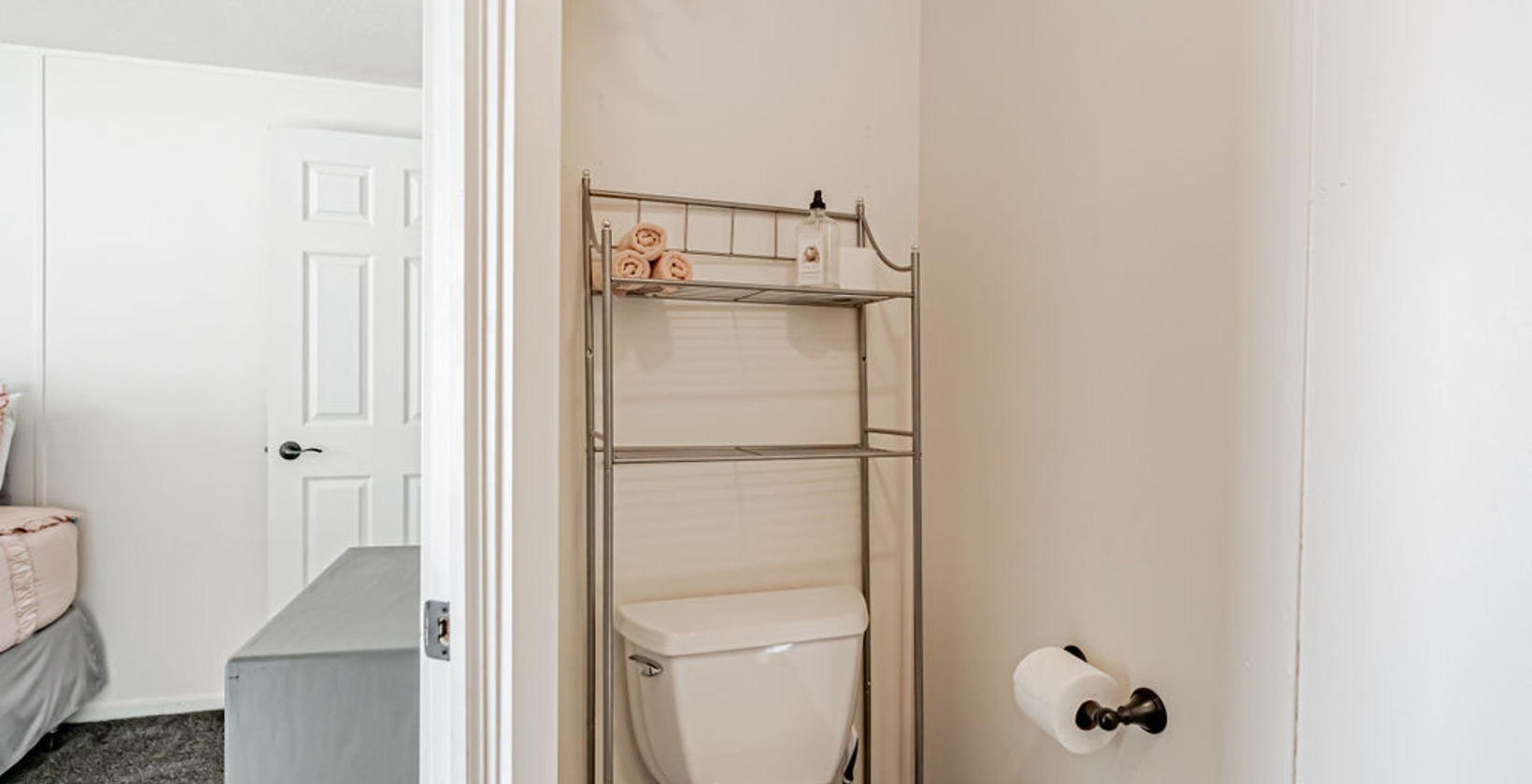 bathroom featuring tile flooring and toilet