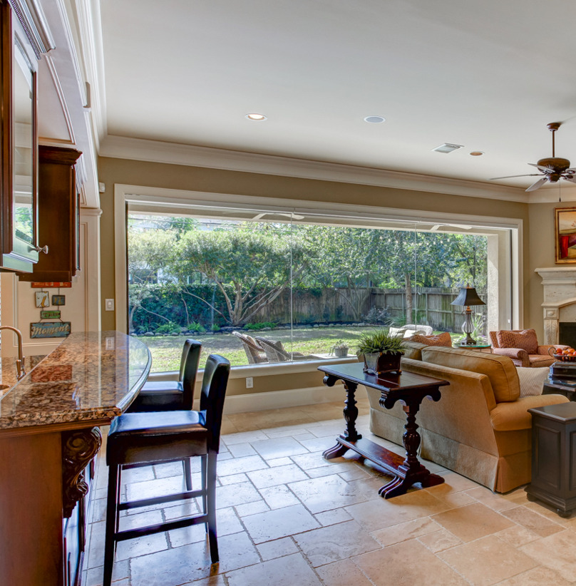 living room with a fireplace and natural light